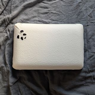 The Panda Memory Foam Bamboo Pillow on a grey linen duvet cover