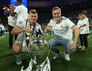 Toni Kroos celebrates Real Madrid's 2022 Champions League win alongside his brother Felix in Paris.