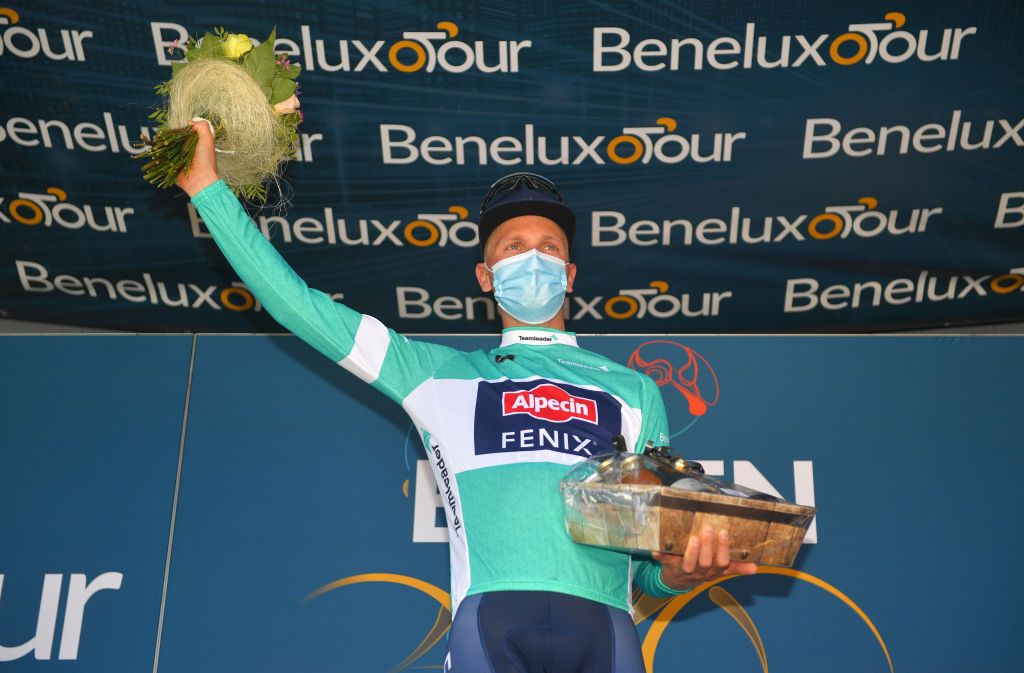 BILZEN BELGIUM SEPTEMBER 03 Tim Merlier of Belgium and Team AlpecinFenix celebrates winning the Turquoise points jersey on the podium ceremony after the 17th Benelux Tour 2021 Stage 5 a 188km stage from Riemst to Bilzen BeneluxTour on September 03 2021 in Bilzen Belgium Photo by Luc ClaessenGetty Images