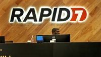 Rapid7 logo and branding pictured in the entrance of the company's headquarters in Boston, USA.