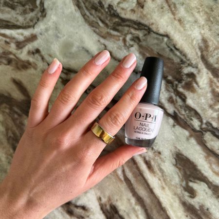 Eleanor's nails painted with OPI'm A Bubble Bunny nail polish on a marble background