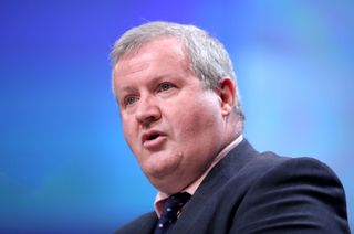 SNP Westminster leader Ian Blackford believes clubs should be strictly liable for the behaviour of their fans