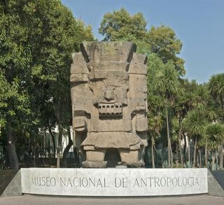 A statue of Tlaloc, the Aztec god of rain, stands at the entrance of the National Museum of Anthropology in Mexico City.