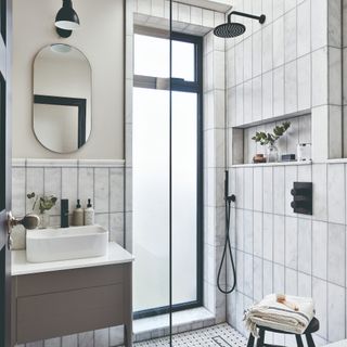 A bathroom with a shower and a sink
