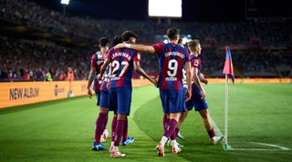 BARCELONA, SPAIN - SEPTEMBER 29: FC Barcelona players celebrate after Sergio Ramos (not pictured) of Sevilla FC scored an own goal during the LaLiga EA Sports match between FC Barcelona and Sevilla FC at Estadi Olimpic Lluis Companys on September 29, 2023 in Barcelona, Spain. (Photo by Alex Caparros/Getty Images)
