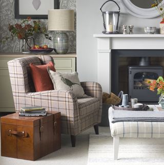 pale grey living room with plaid armchair