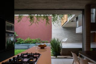 Outdoor living space at Casa Floresta by Estúdio Zargos, a Belo Horizonte home