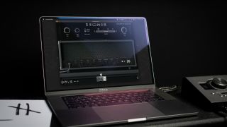 A Laptop with Neural DSP Archetype Gojira running on it and an audio interface next to it