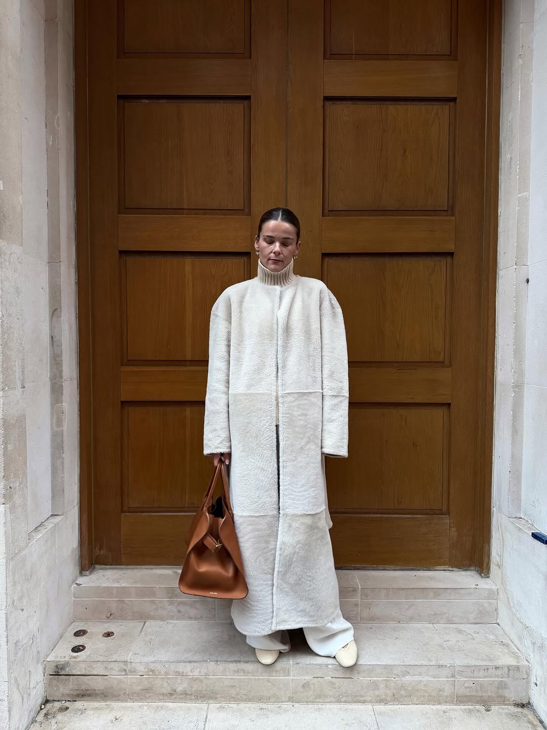 woman wearing cream coat outfit 2026