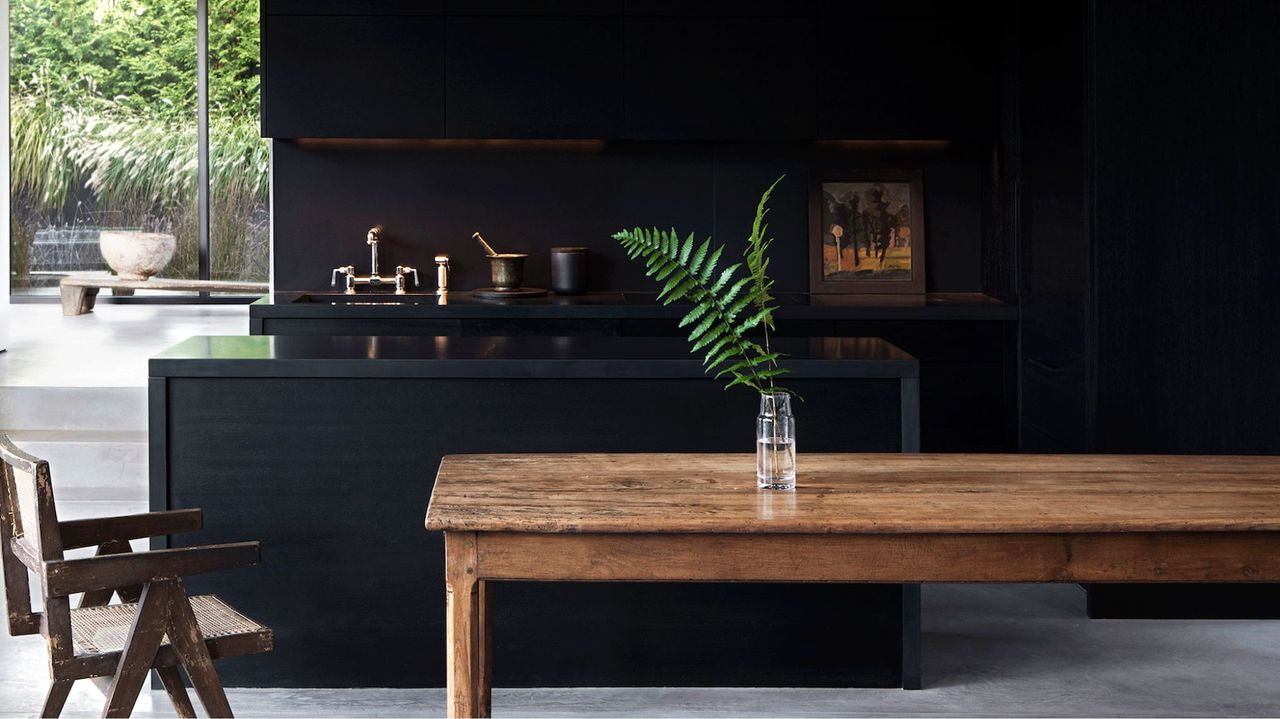 black kitchen with wooden island