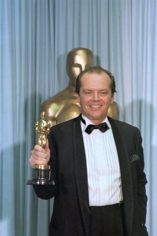 Jack Nicholson holding his Oscar