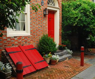 red brick house with red front door
