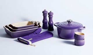 le creuset ultra violet cookware hand gloves white background