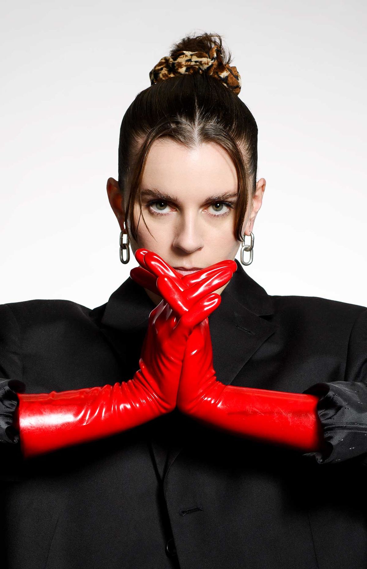 Lyndsey Gunnulfsen of the band Pvris poses for a portrait in red gloves