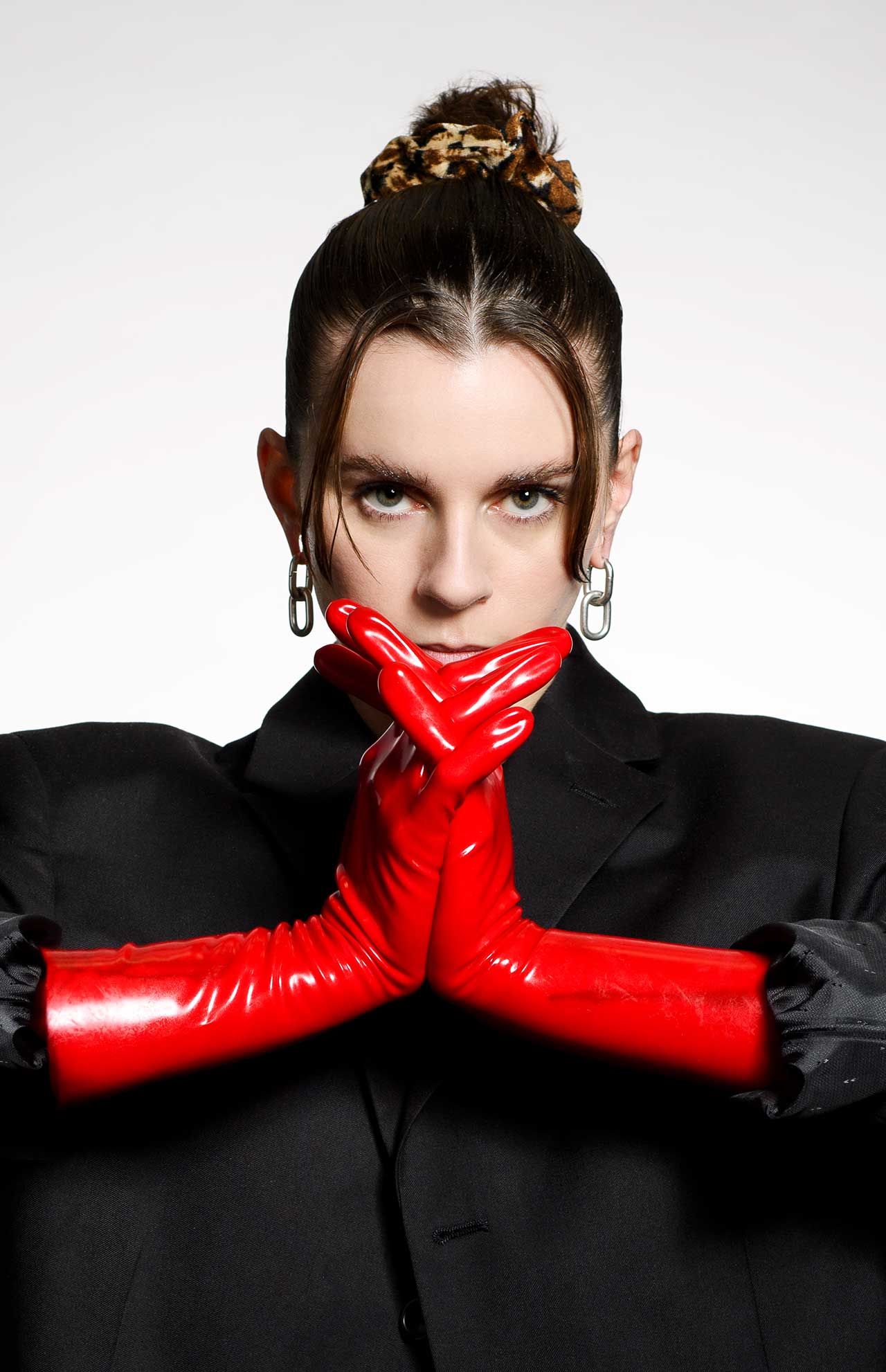 Lyndsey Gunnulfsen of the band Pvris poses for a portrait in red gloves