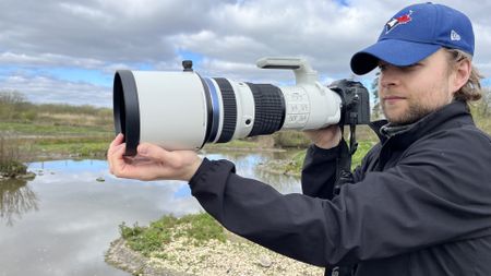 Mike Harris holding OM System M.Zuiko 150-400mm f/4.5 TC1.25x IS PRO at Slimbridge Wetland Centre 