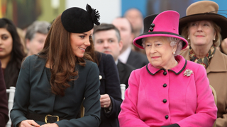 Queen Elizabeth II (R) and Catherine, Duchess of Cambridge (L) watch a fashion show at De Montfort University on March 8, 2012 in Leicester, England