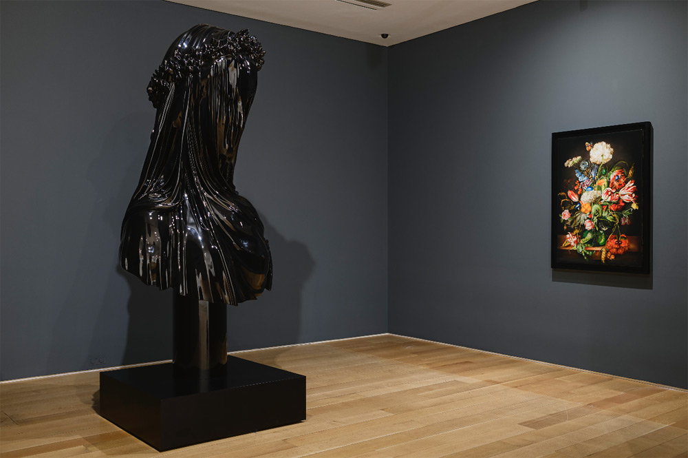 painting on grey wall and a black sculpture