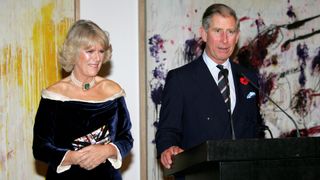 NEW YORK - NOVEMBER 01: Prince Charles, Prince of Wales, speaks as his wife Camilla, Duchess of Cornwall, looks on at the Museum of Modern Art (MOMA) reception on the first day of their eight-day visit to the U.S., on November 1, 2005 in New York City.