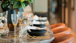 laid dinner table with napkins on plates