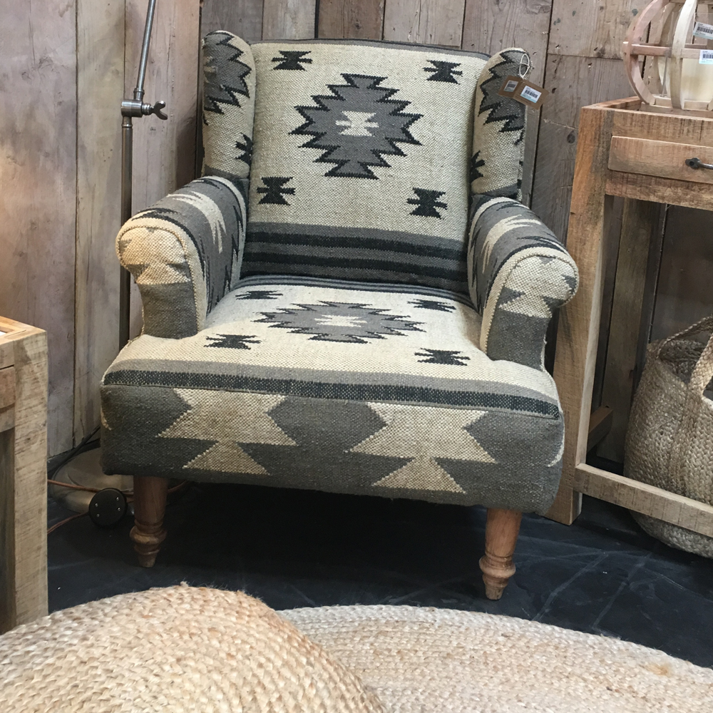 armchair with wooden wall