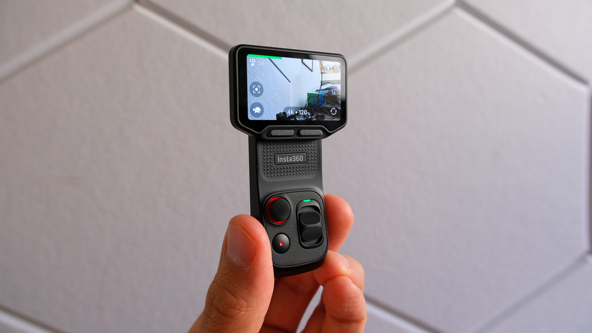 Insta360 Luna Ultra detachable controller in hand