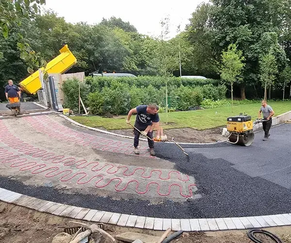 A Heated Driveway Systems installation. Tarmac is laid over the electric radiant heating system.
