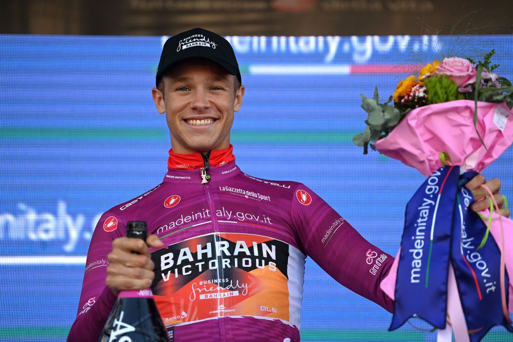 MONTE LUSSARI ITALY MAY 27 Jonathan Milan of Italy and Team Bahrain Victorious Purple Points Jersey celebrates at podium during the 106th Giro dItalia 2023 Stage 20 a 186km individual climbing time trial stage from Tarvisio 750m to Monte Lussari 1744m UCIWT on May 27 2023 in Monte Lussari Italy Photo by Tim de WaeleGetty Images