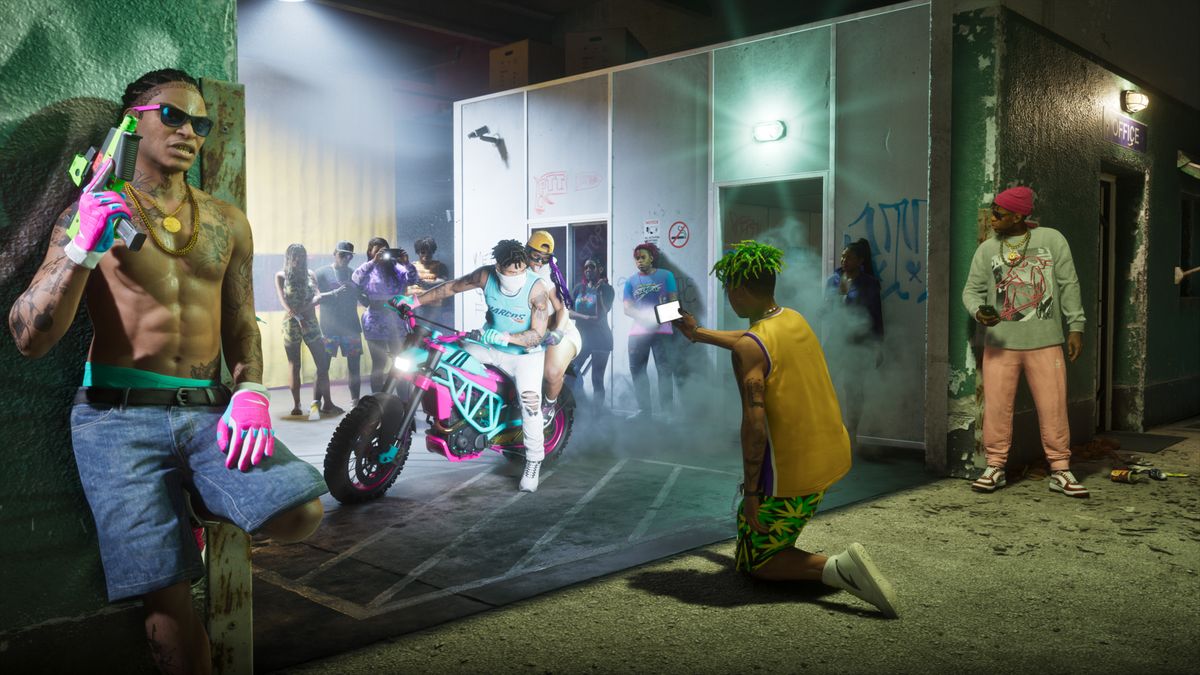 Crowd of people and a motorcycle.