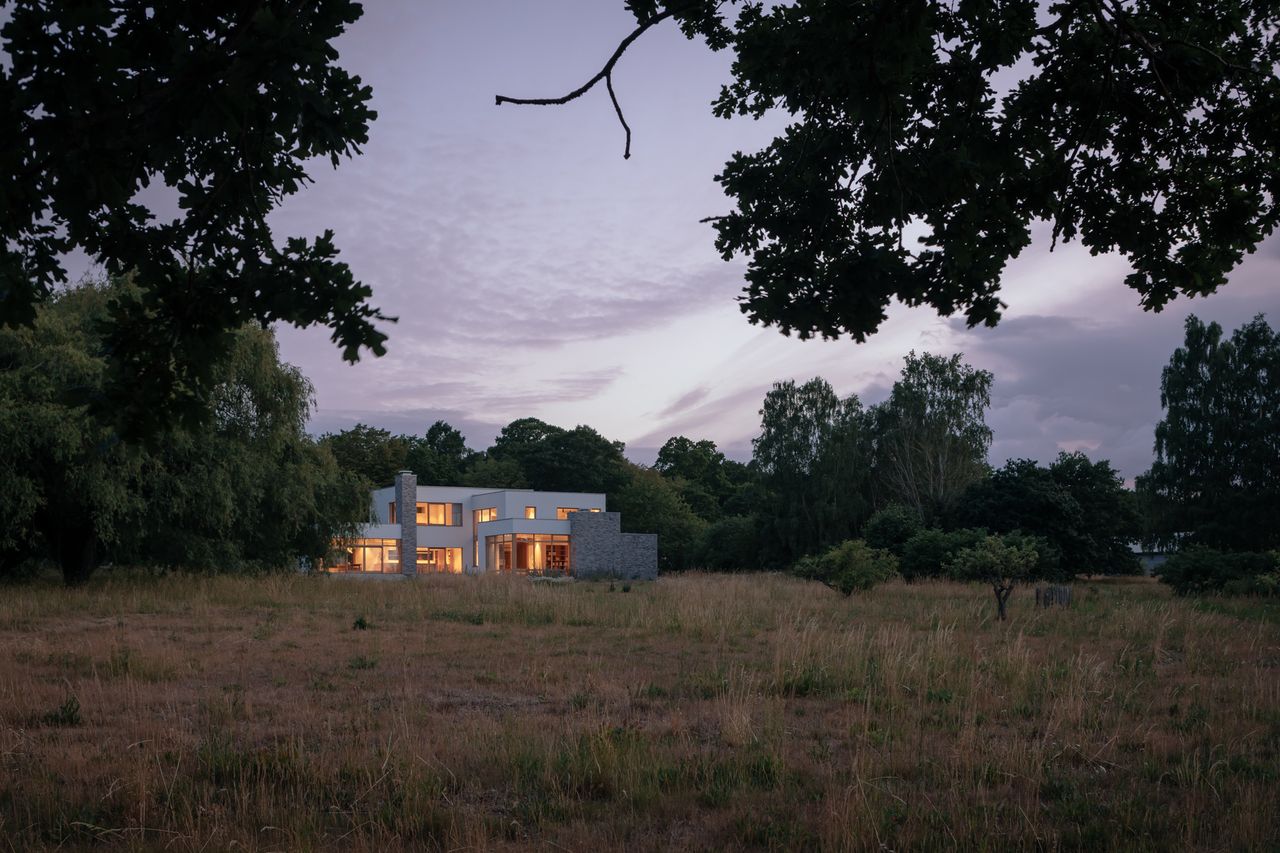 nighttime exterior among nature of Hallen, a Swedish countryside house