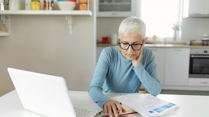 Woman Worried About Bills and Debt Doing Banking and Administrative Work at Home