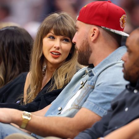 Taylor Swift and Travis Kelce attending the NBA Eastern Conference finals wearing matching outfits