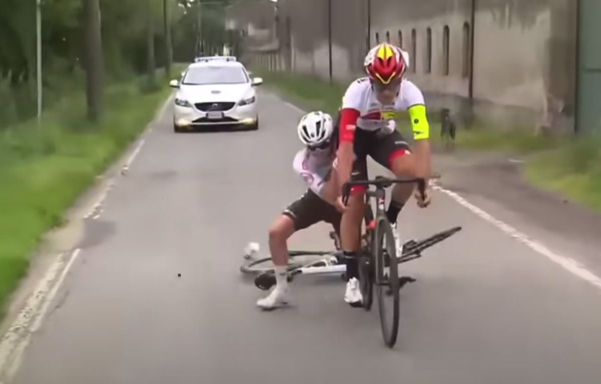 Under-23 rider defies laws of physics as he grabs onto back of rival's ...
