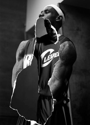 Black & white poster of a basketball player being ripped in the middle and showing another basketball player.