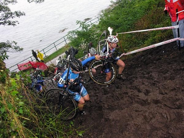 Elite women climb the run-up by the Atlantic Ocean.