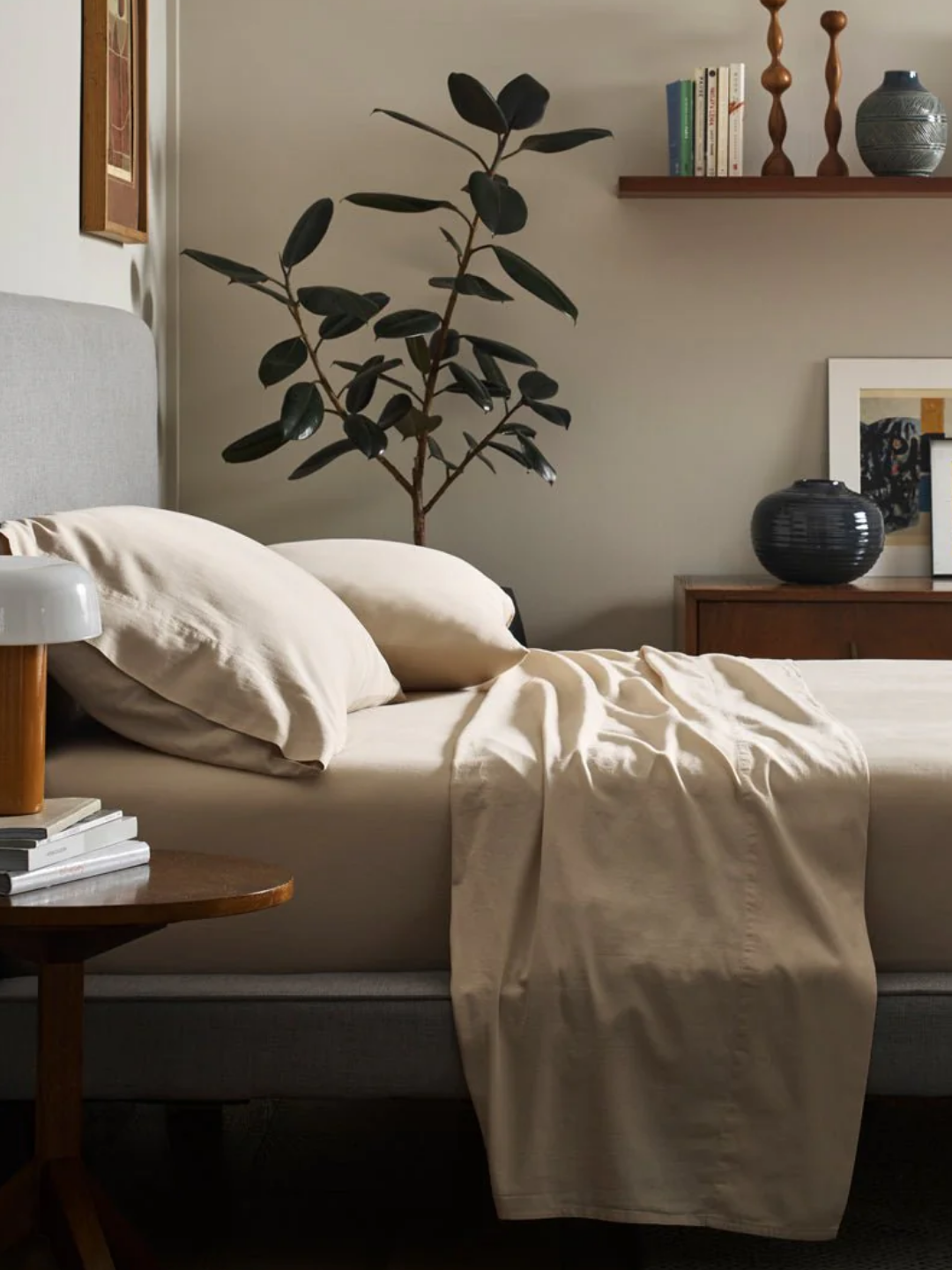 A bedroom with a muted bedding set