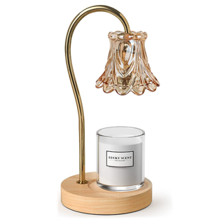 An ornate gold candle warmer lamp