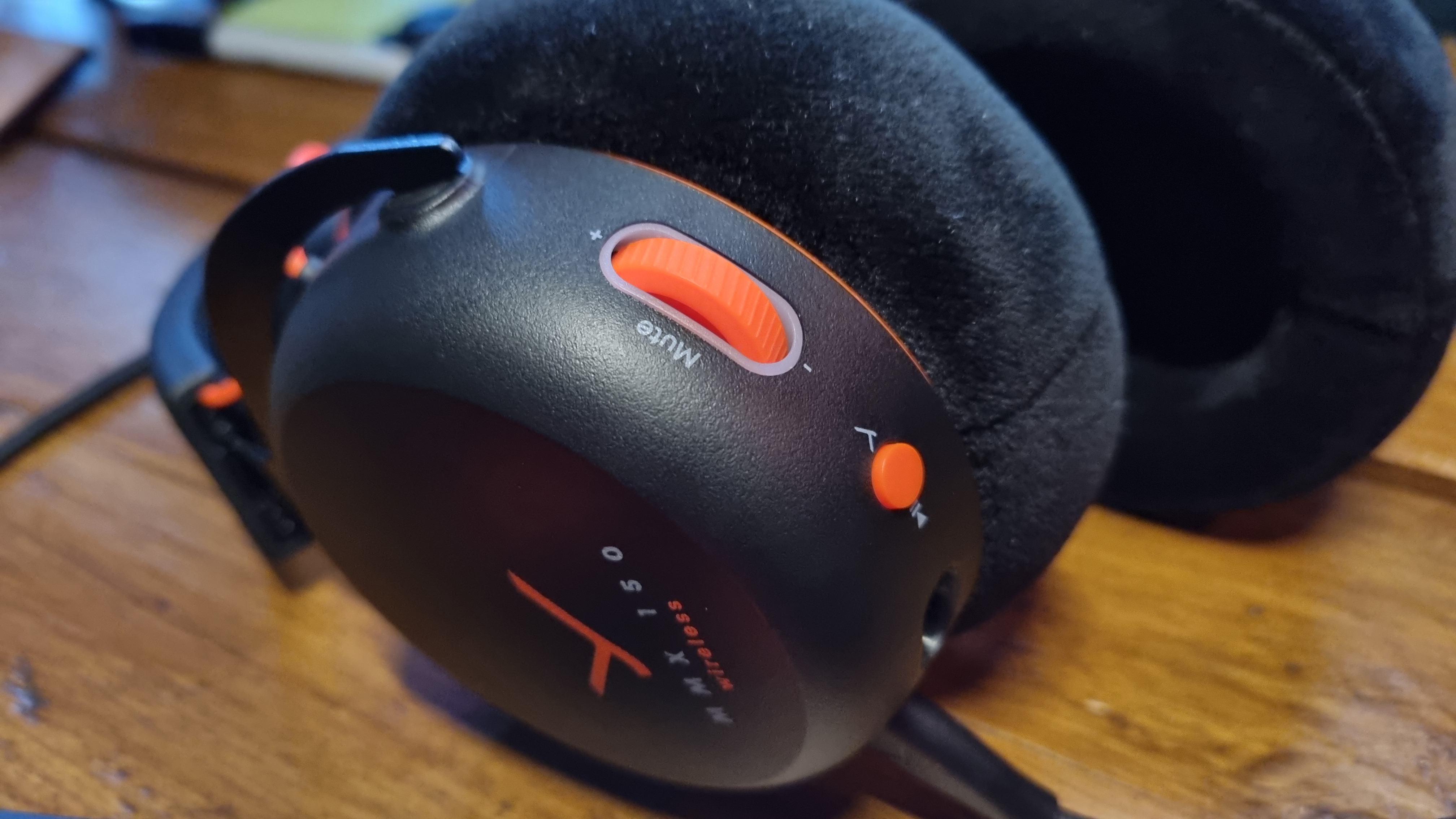 A close up of the controls on the left earcup of the Beyerdynamic MMX 150 Wireless gaming headset