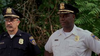 Two police officers in uniform looking frustrated in The Wire