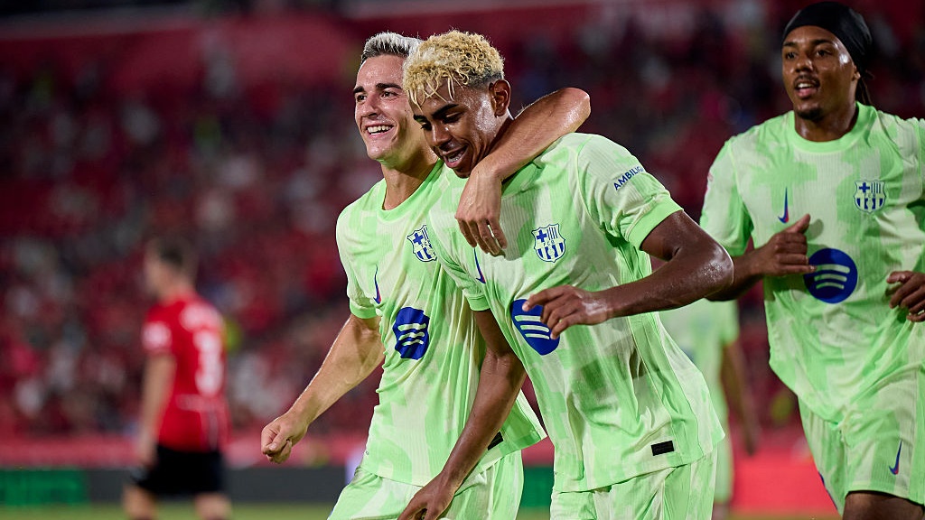 Lamine Yamal of FC Barcelona celebrates after scoring his team third goal during the LaLiga EA Sports match between RCD Mallorca and FC Barcelona at Estadio de Son Moix on August 16, 2025 in Mallorca, Spain.