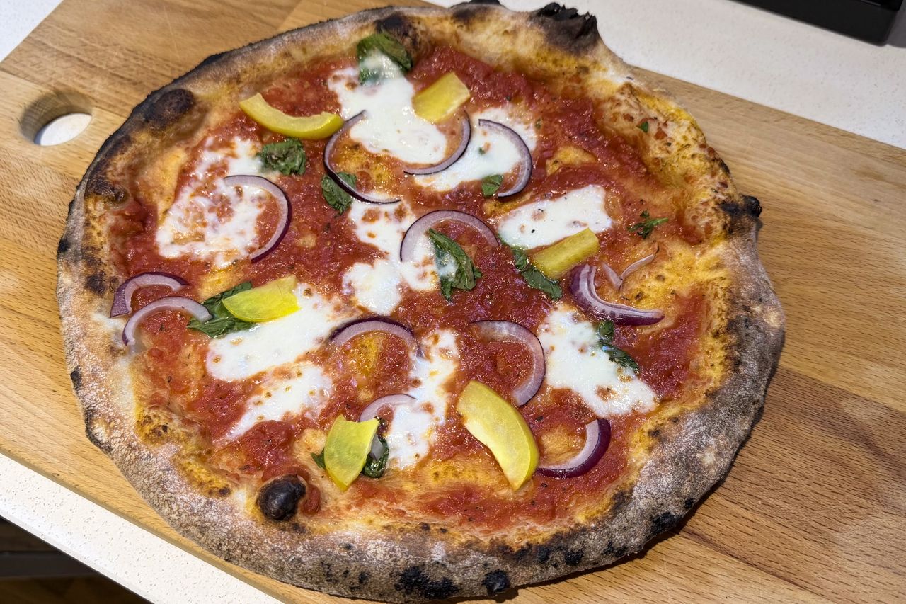 A pizza on a chopping board