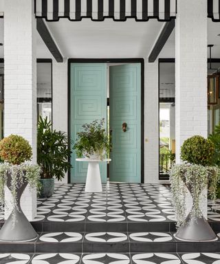 Grey and white tile floor, green double doors