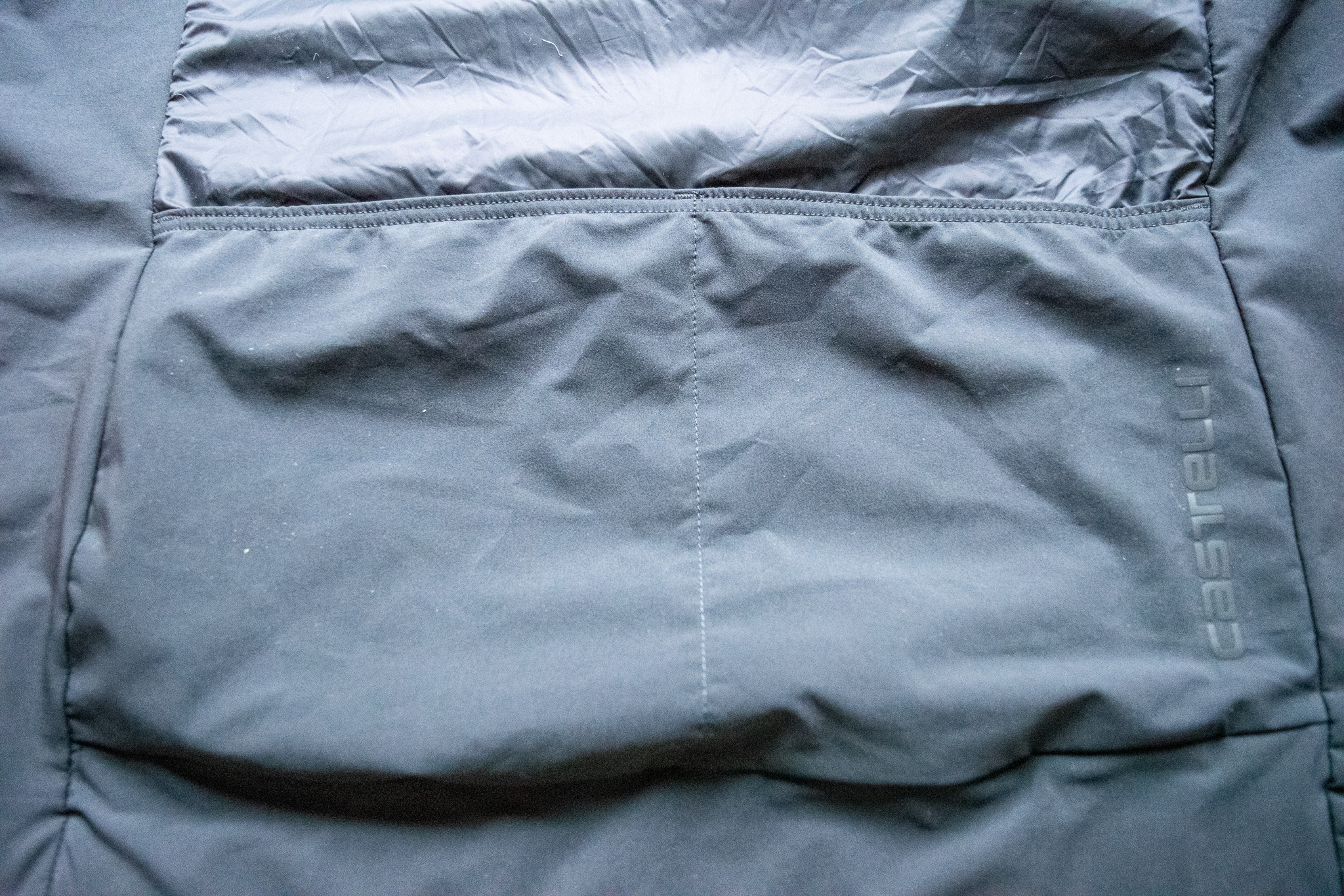 A Castelli Unlimited Puffy vest closeup showing the zipper