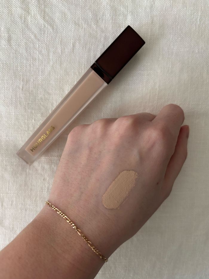 Deputy beauty editor Grace Lindsay testing an Hourglass concealer on the back of her hand