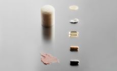 Men's beauty brands Beau.D, Tracaris Saint New York, and Asystem out of their packaging and laid out on a silver background