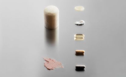 Men's beauty brands Beau.D, Tracaris Saint New York, and Asystem out of their packaging and laid out on a silver background