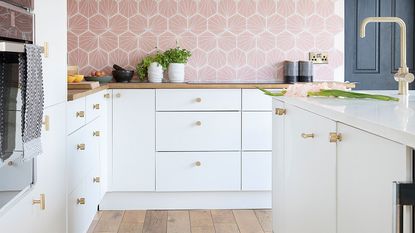 White kitchen with pink backsplash