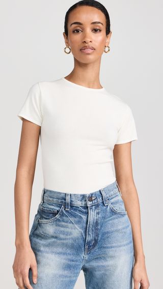 a model wears a white short-sleeve T-shirt