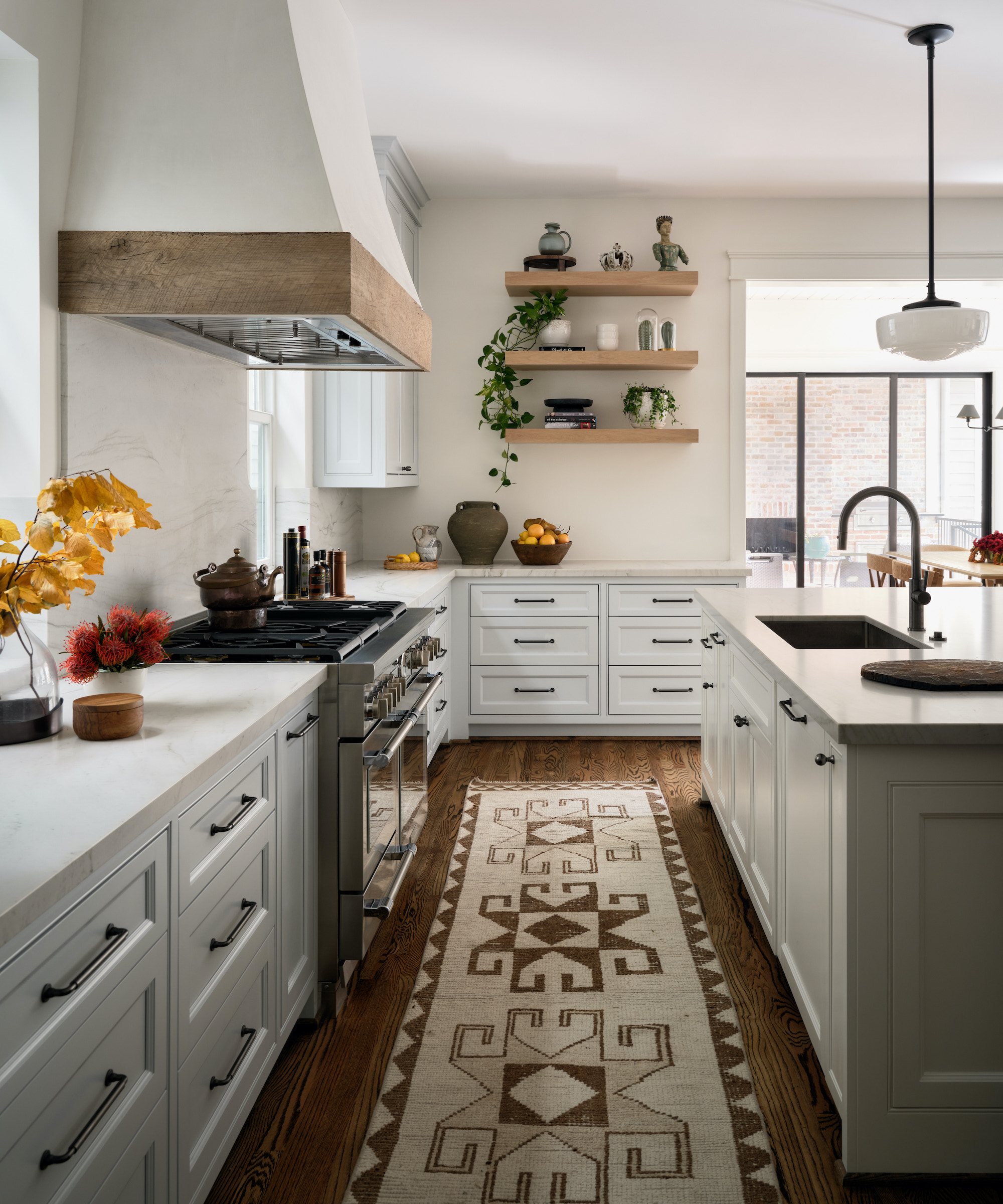 grey kitchen with wood decals and aztec runner