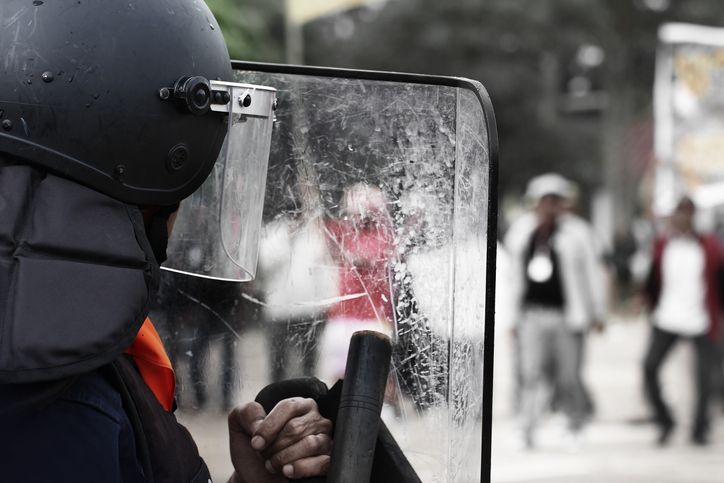 Police officer in riot gear. 